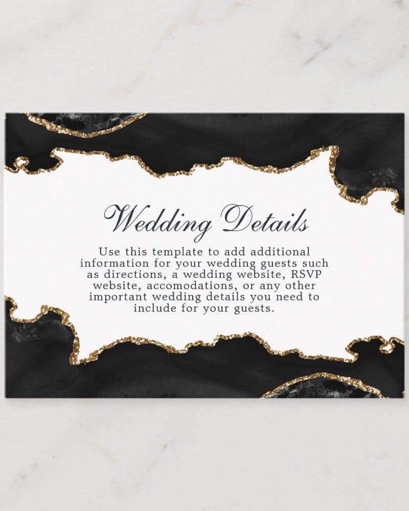 Black and gold wedding details card with agate design.