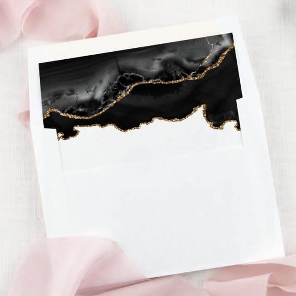 White Envelope With A Black And Gold Glitter Agate Design At The Top.