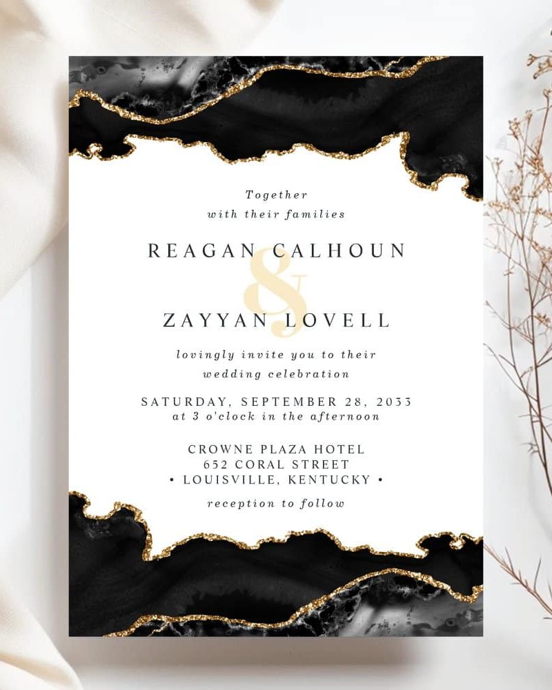 Wedding invitation with black and gold agate design featuring Reagan Calhoun and Zayyan Lovell's names and wedding details.
