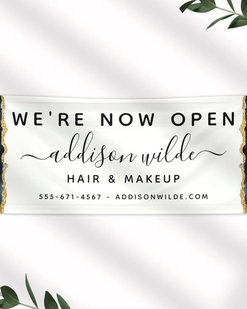 Grand opening banner for Addison Wilde Hair & Makeup, showing business name, phone number, and website.