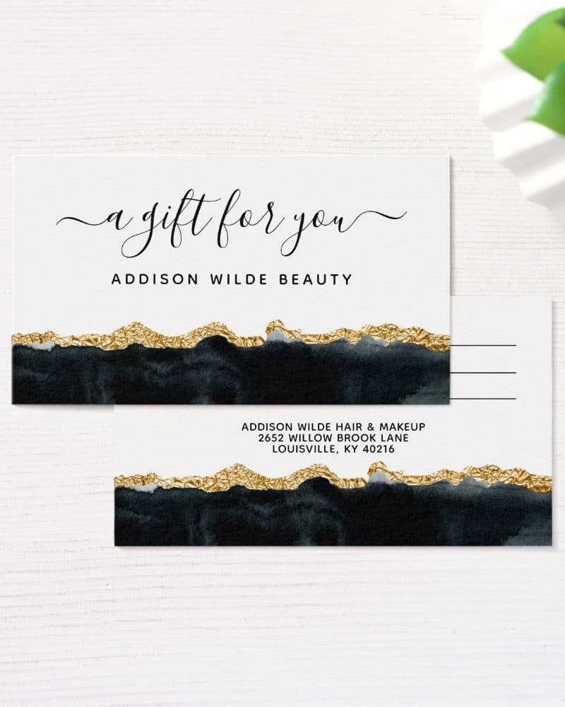 A gift certificate and postcard for Addison Wilde Beauty, featuring a dark background with gold accents.