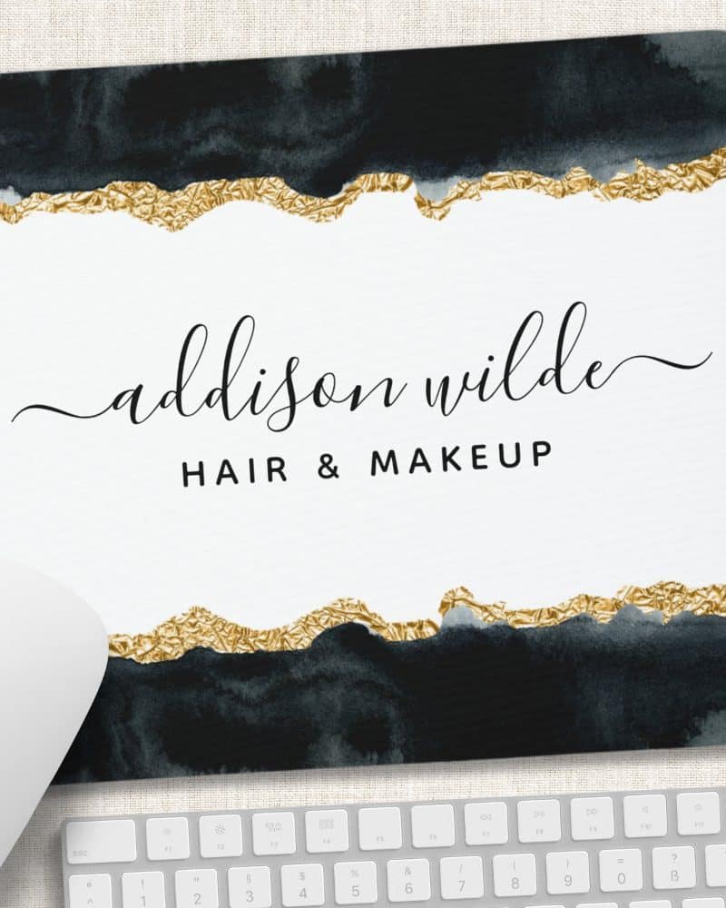Mousepad with Addison Wilde Hair & Makeup logo; dark blue watercolor design with gold foil accents.
