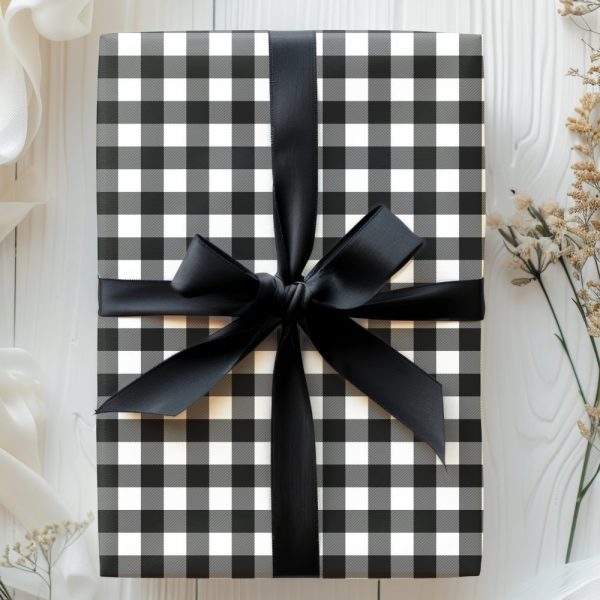 Black And White Checkered Gift Box With A Black Ribbon.