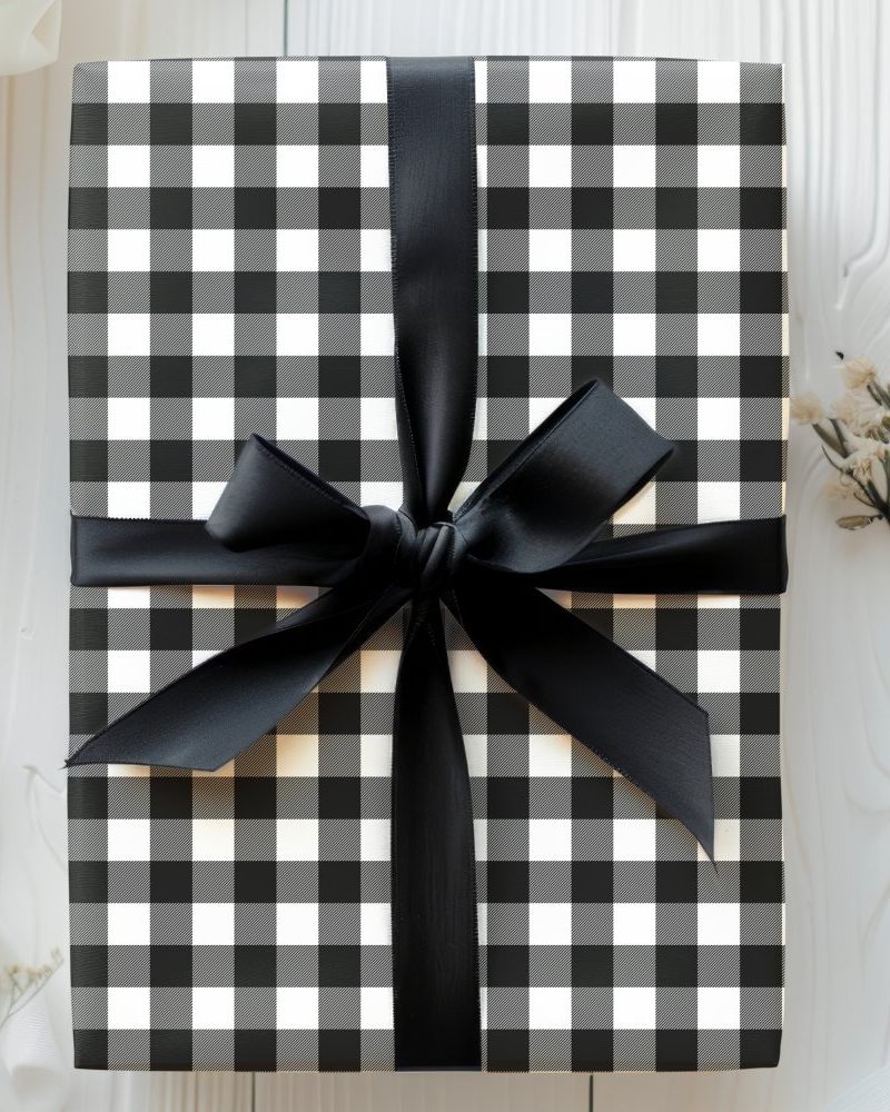 Black and white checkered gift box with a black ribbon.