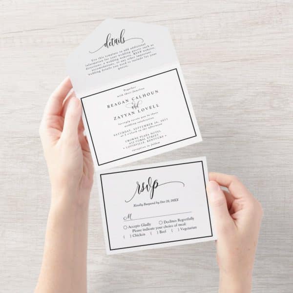 Hands Hold A Tri-Fold Wedding Invitation With An Rsvp Card. The Invitation Features The Names Reagan Calhoun And Zayyan Lovell, Wedding Date, Time, And Location.