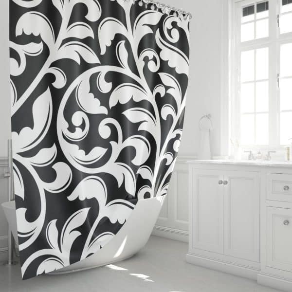 Black And White Damask Shower Curtain Partially Draped Over A White Bathtub.