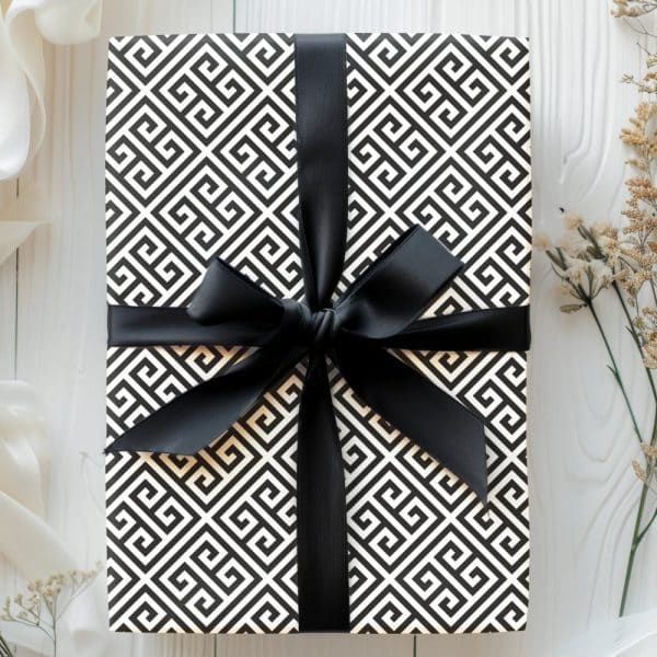 Black And White Geometrically Patterned Gift Box With A Black Ribbon Bow.