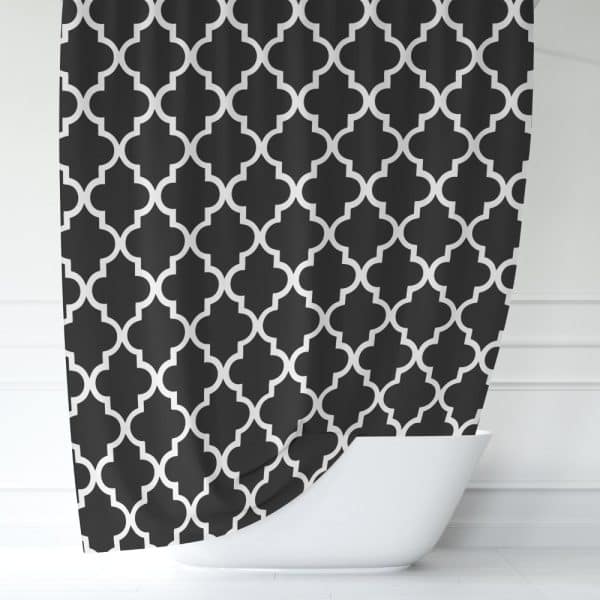 Black Shower Curtain With A White Quatrefoil Pattern.
