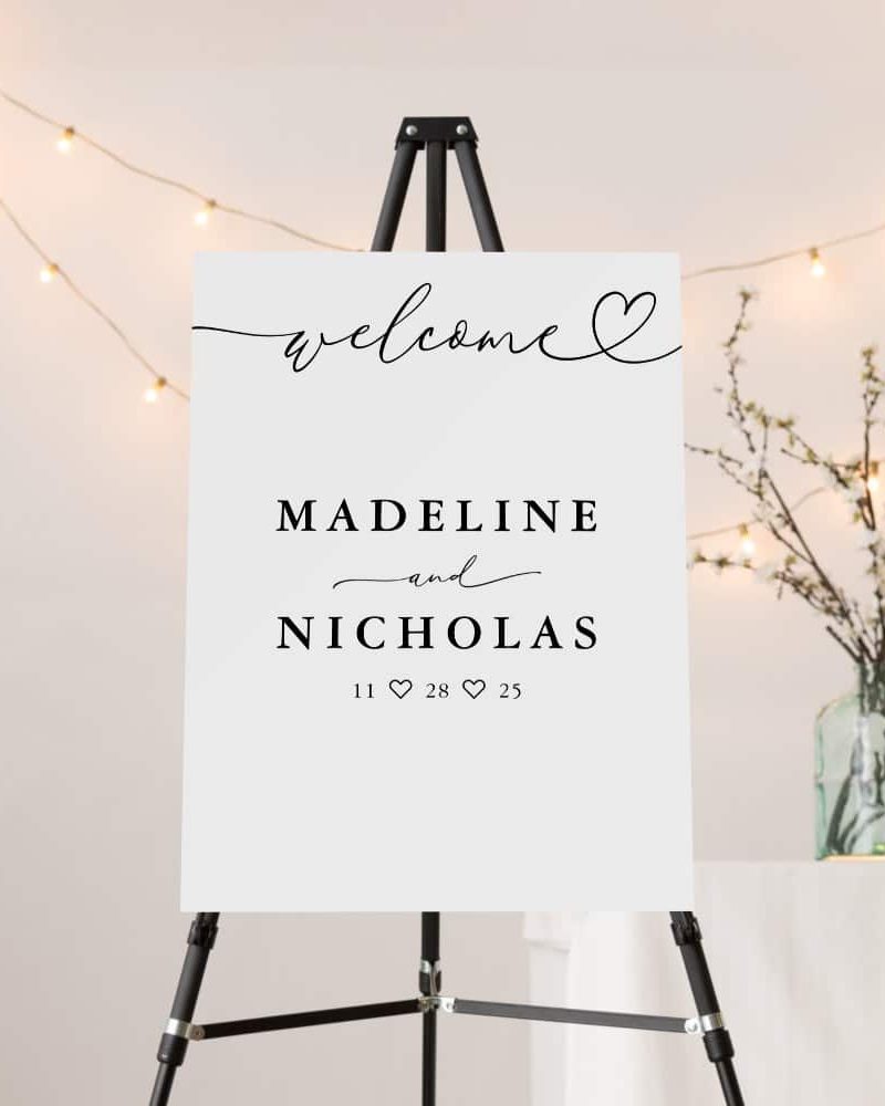 A wedding welcome sign on an easel displaying Madeline and Nicholas's names and wedding date.