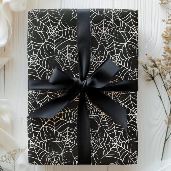 Black Gift Box With White Spiderwebs And A Black Ribbon.