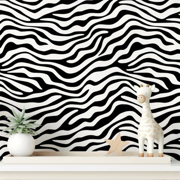 A White Giraffe Toy And Small Potted Plant Sit On A Shelf In Front Of A Black And White Zebra Striped Wall.