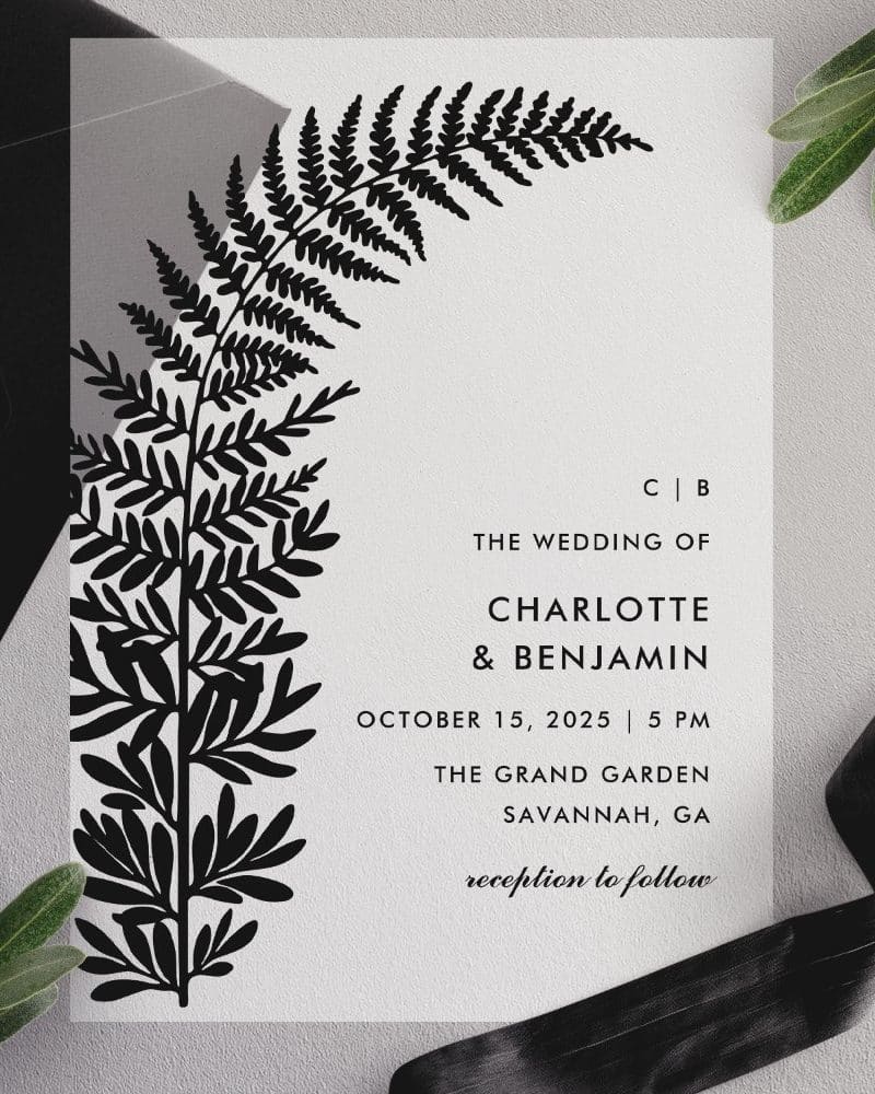 Wedding invitation featuring a black fern illustration and the couple's names and wedding details.