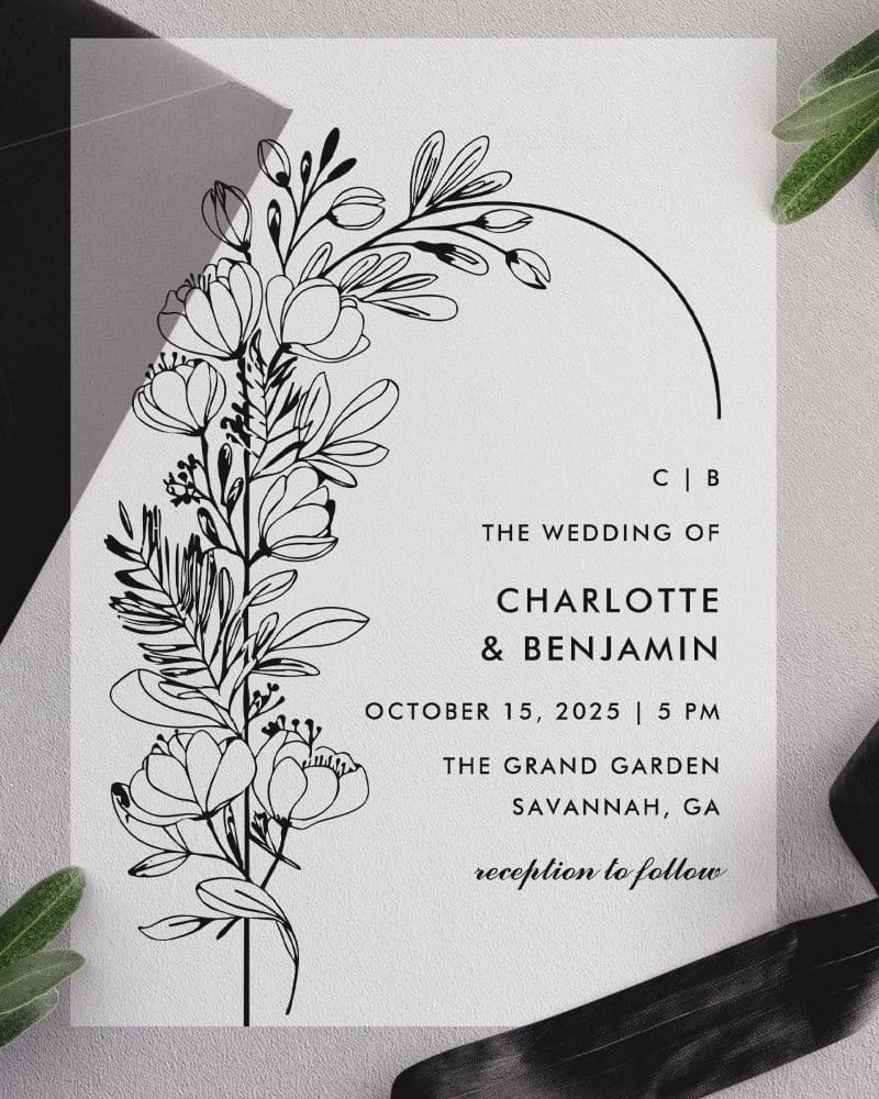 Wedding invitation with black line drawing of flowers and foliage.