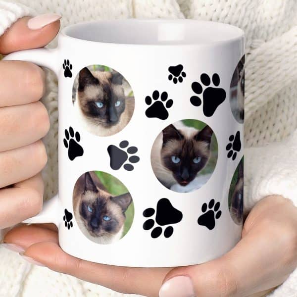 White Coffee Mug With Paw Prints And Multiple Photos Of A Siamese Cat.