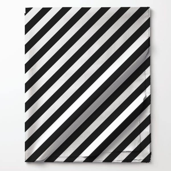 Black And White Diagonal Striped Fabric Folded On A White Background.