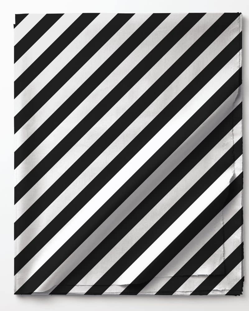 Black and white diagonal striped fabric folded on a white background.