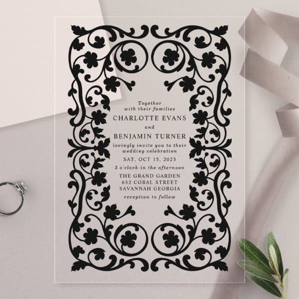 Clear Acrylic Wedding Invitation With Black Ornate Border And Wedding Details.