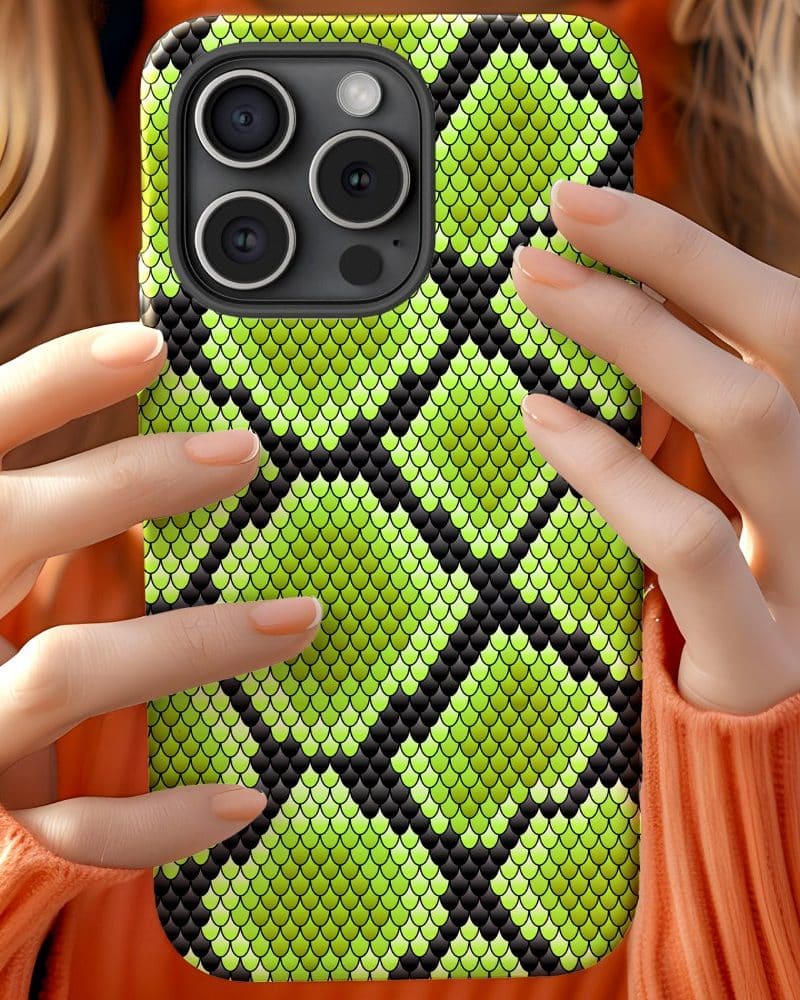 Close up of hands holding a lime green snakeskin iPhone case.