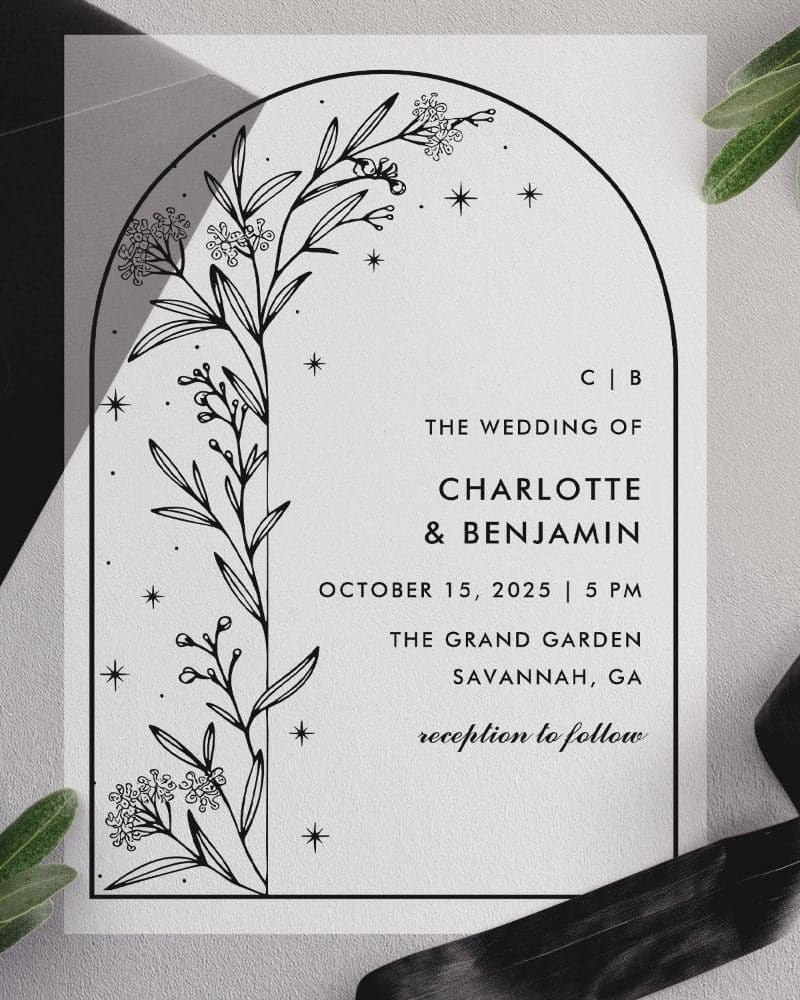 Wedding invitation featuring a floral illustration within an arched border; names and wedding details are listed below.