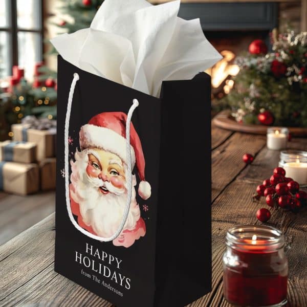 Black Gift Bag With A Vintage Santa Claus Illustration, &Quot;Happy Holidays&Quot; Text, And A Personalized Sender'S Name.