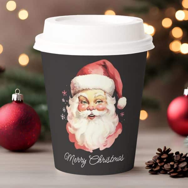 A Dark Gray Christmas Coffee Cup Features A Vintage Illustration Of Santa Claus. Merry Christmas Is Written Below.