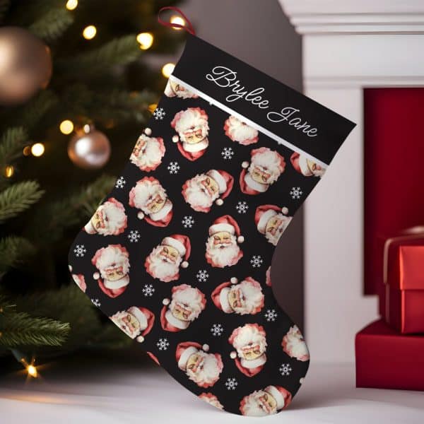 Personalized Christmas Stocking With A Black Background And Repeating Pattern Of Santa Claus Faces.