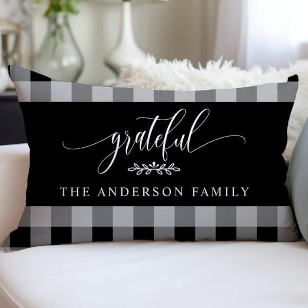 Black And Gray Buffalo Plaid Pillow With The Word Grateful In A Script Font And The Text The Anderson Family.