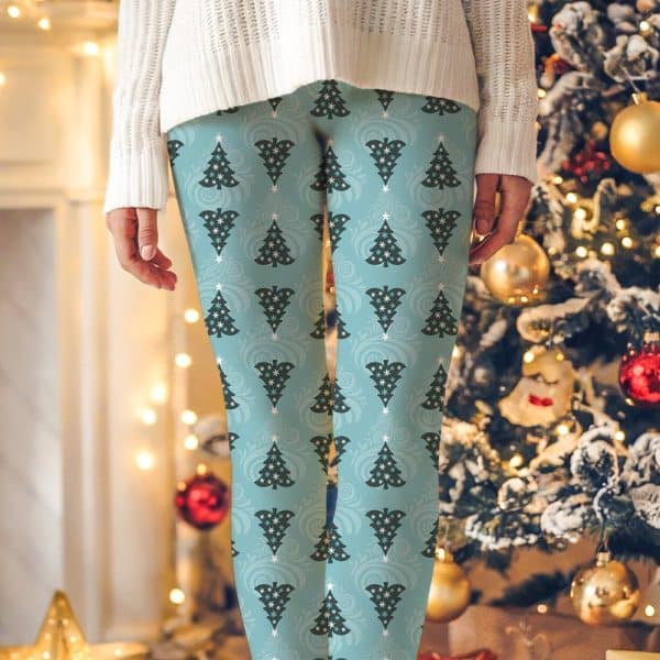 Teal Leggings Featuring A Repeating Pattern Of Dark Green Stylized Christmas Trees.
