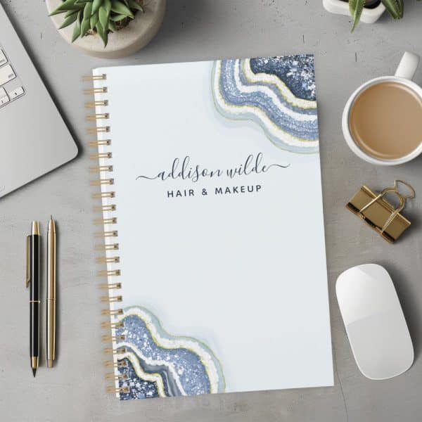 Spiral-Bound Notebook With A Light Blue Cover Featuring An Agate Design And The Name Addison Wilde Hair &Amp; Makeup.