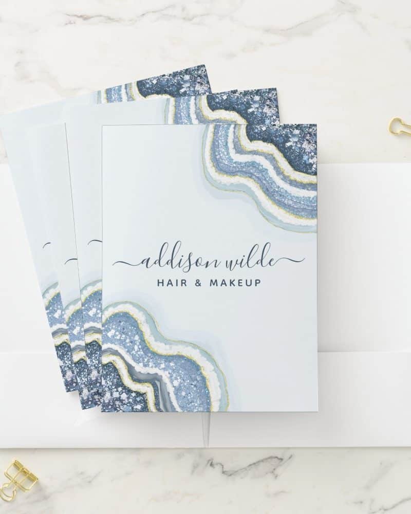 Stack of hair and makeup business cards featuring a blue agate design.