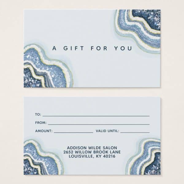 A Light Blue Gift Certificate With Agate Design Features A Section For Recipient And Giver Information, Amount, And Validity Date. The Salon'S Name And Address Are Printed At The Bottom.