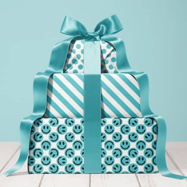 Stack Of Three Teal Wrapped Presents With A Large Teal Ribbon. The Boxes Feature Different Patterns.