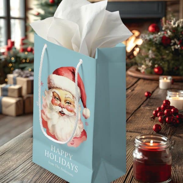 Light Blue Gift Bag With A Vintage Santa Claus Illustration And The Words Happy Holidays From The Andersons.
