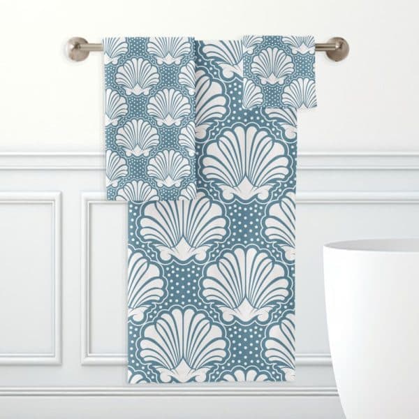 Teal Bath Towels With A White Seashell Pattern.