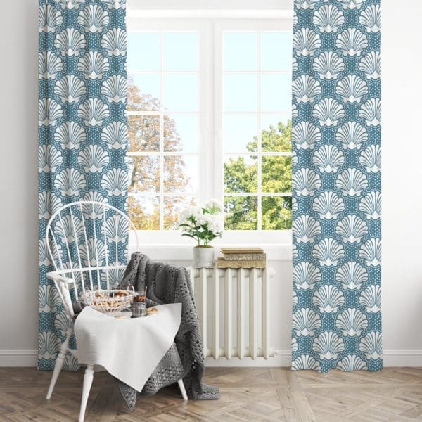 A Pair Of Teal Curtains With A White Seashell Pattern Hangs In A Window.