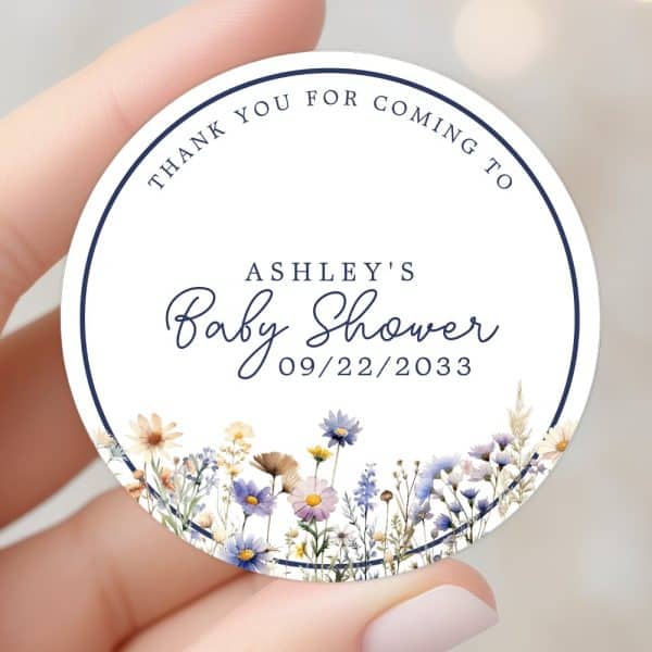 Round Baby Shower Thank You Sticker With Wildflowers And Ashley'S Name And Shower Date.