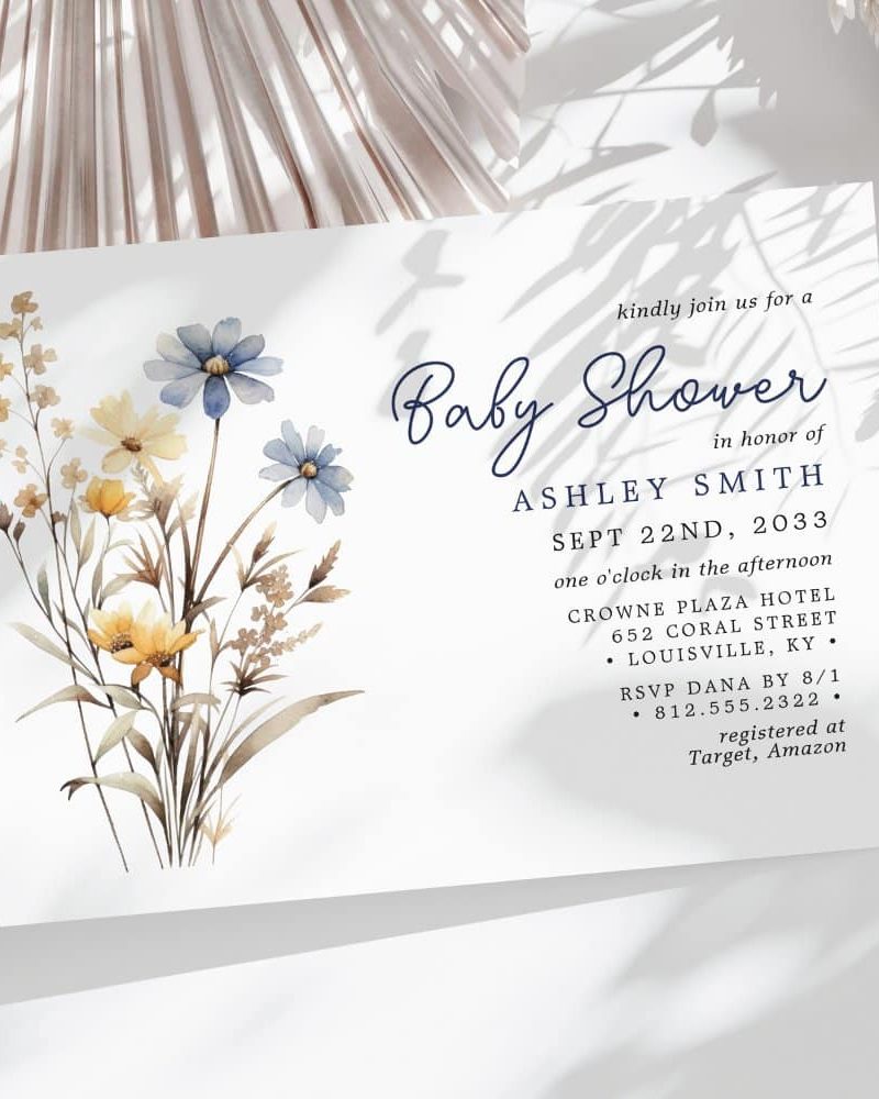 Baby shower invitation with watercolor floral design in blues and yellows.
