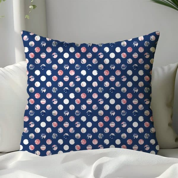 Blue Pillow With A White Polka Dot Pattern; Each Dot Contains A Pink And Blue Floral Design.