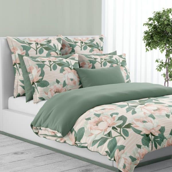 A Bed With A Floral Duvet Cover And Matching Pillows. The Bedding Features A Pale Pink And Green Striped Pattern With Large Peony Blossoms.