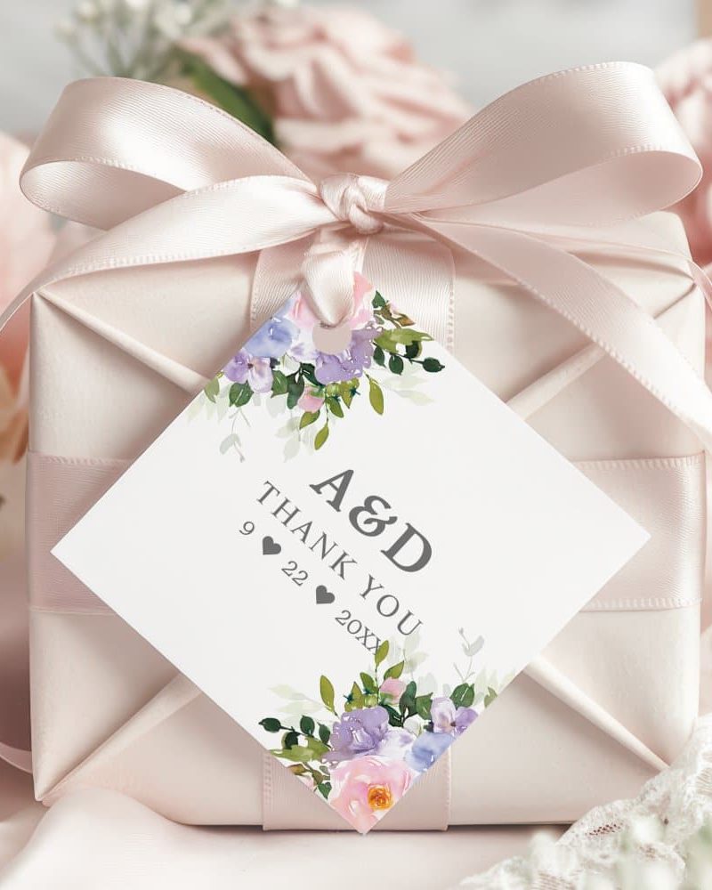 A wedding thank you gift tag with lavender and pink flowers and the initials A&D.
