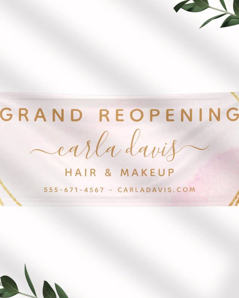 Grand reopening banner for Carla Davis Hair & Makeup. Contact information is included.