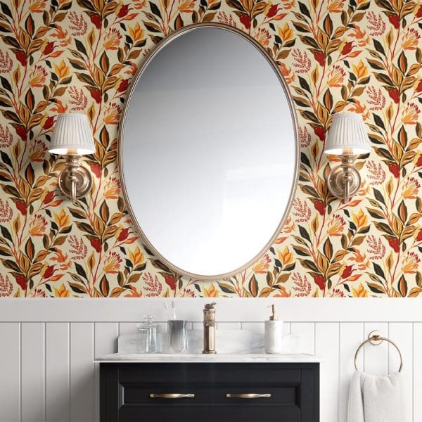 Oval Mirror Above A Bathroom Vanity With Autumnal Floral Wallpaper.