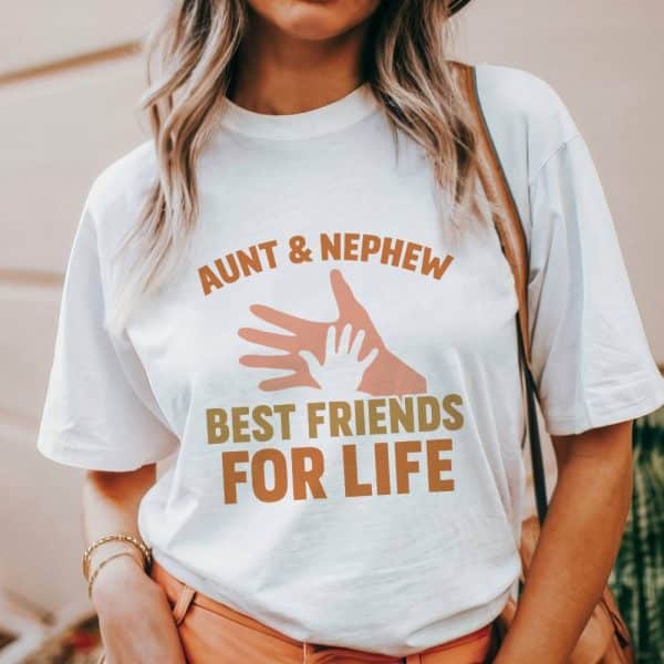 Woman Wearing A White T-Shirt That Says Aunt &Amp; Nephew Best Friends For Life, With An Image Of Two Hands.