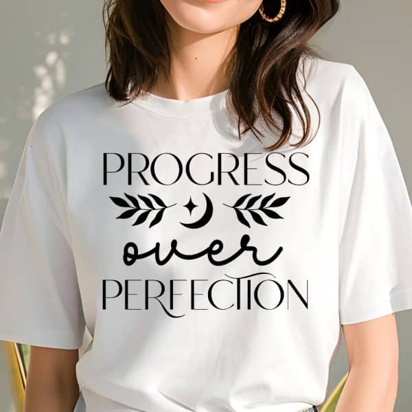 Woman Wearing A White T-Shirt With The Text Progress Over Perfection.