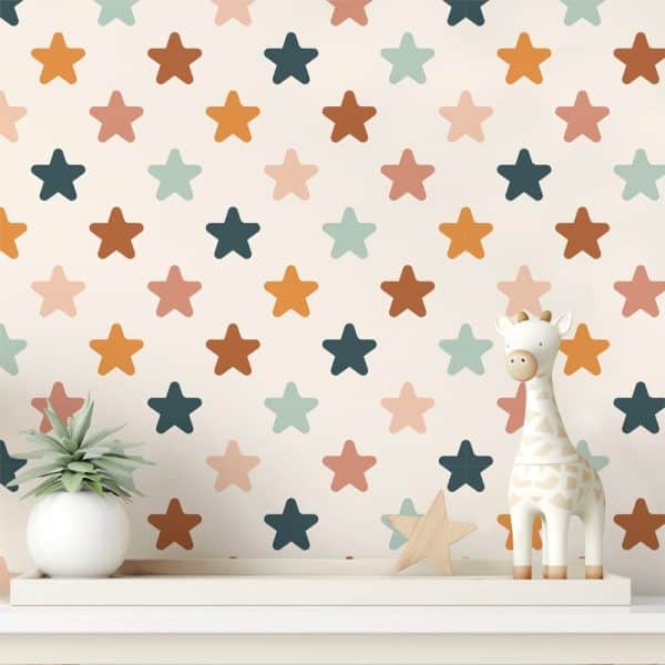 A White Shelf Holds A Small Potted Plant And A Giraffe Toy In Front Of A Wall Covered In A Multicolored Star Pattern.