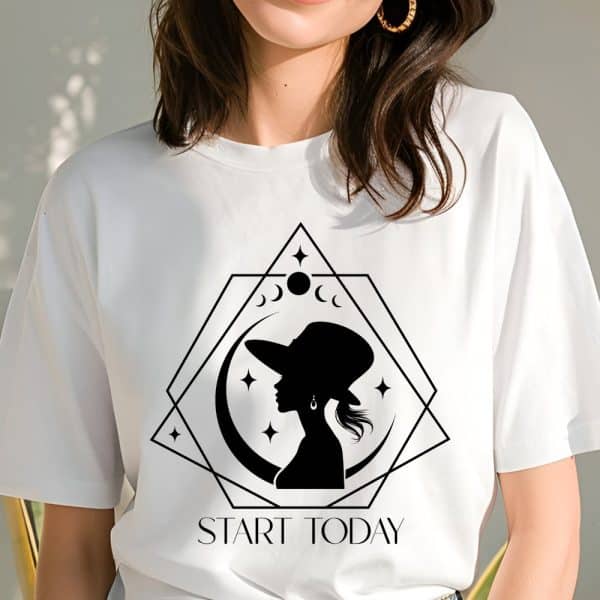 White T-Shirt With A Black Silhouette Of A Woman Wearing A Hat, Inside A Geometric Moon Design. The Words Start Today Are Printed Below.