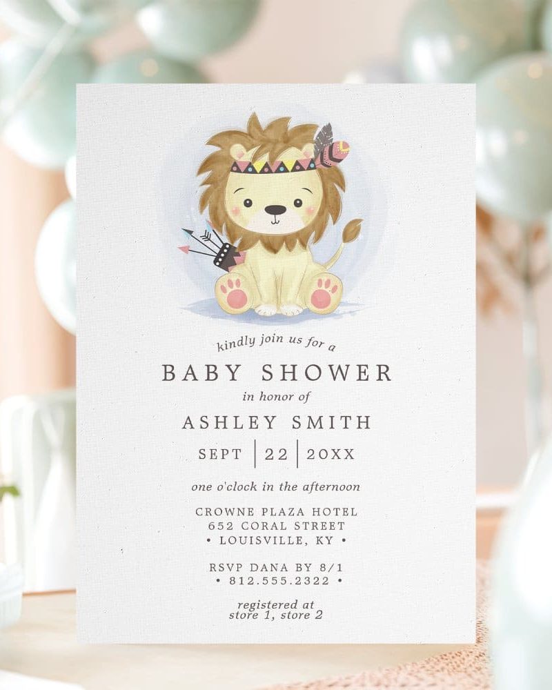 Baby shower invitation featuring a watercolor illustration of a lion wearing a headdress.