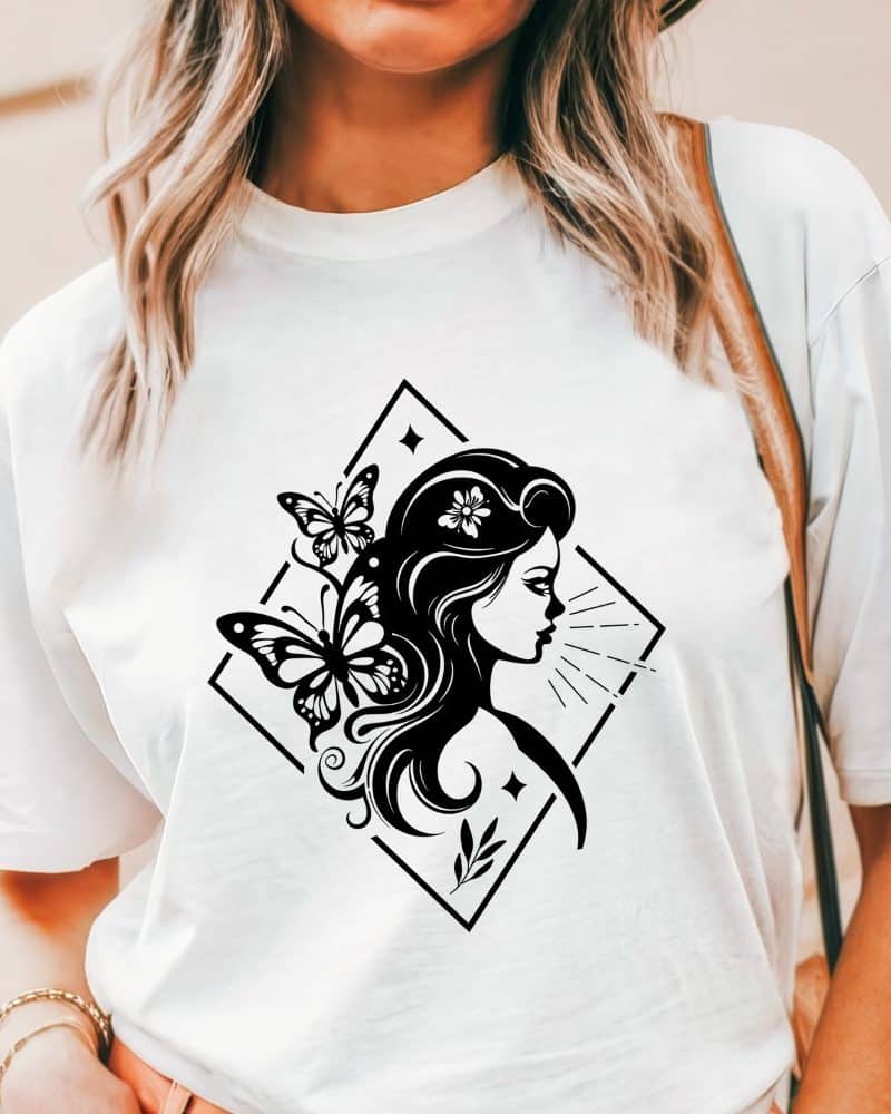 White t-shirt with a black graphic design of a woman's profile, adorned with butterflies.