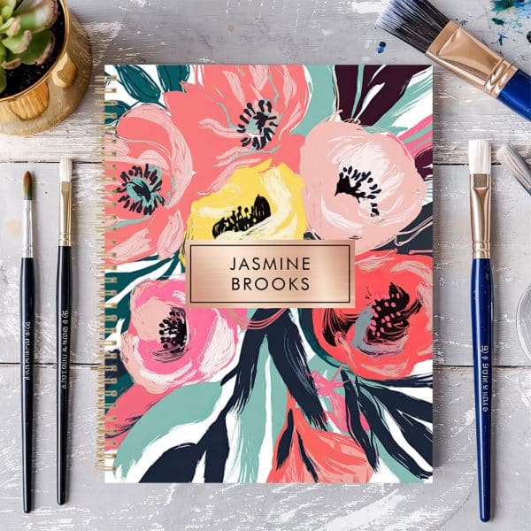Spiral-Bound Notebook With A Floral Design And The Name Jasmine Brooks.