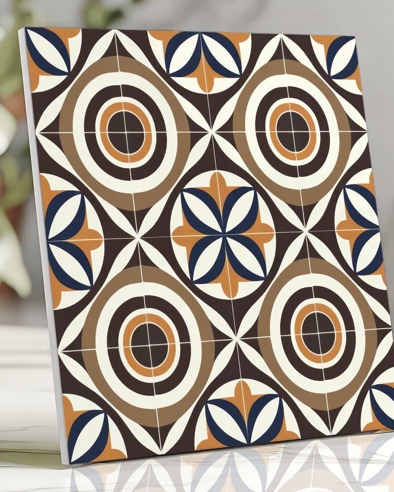 Square tile sample with repeating geometric pattern in brown, orange, and blue.